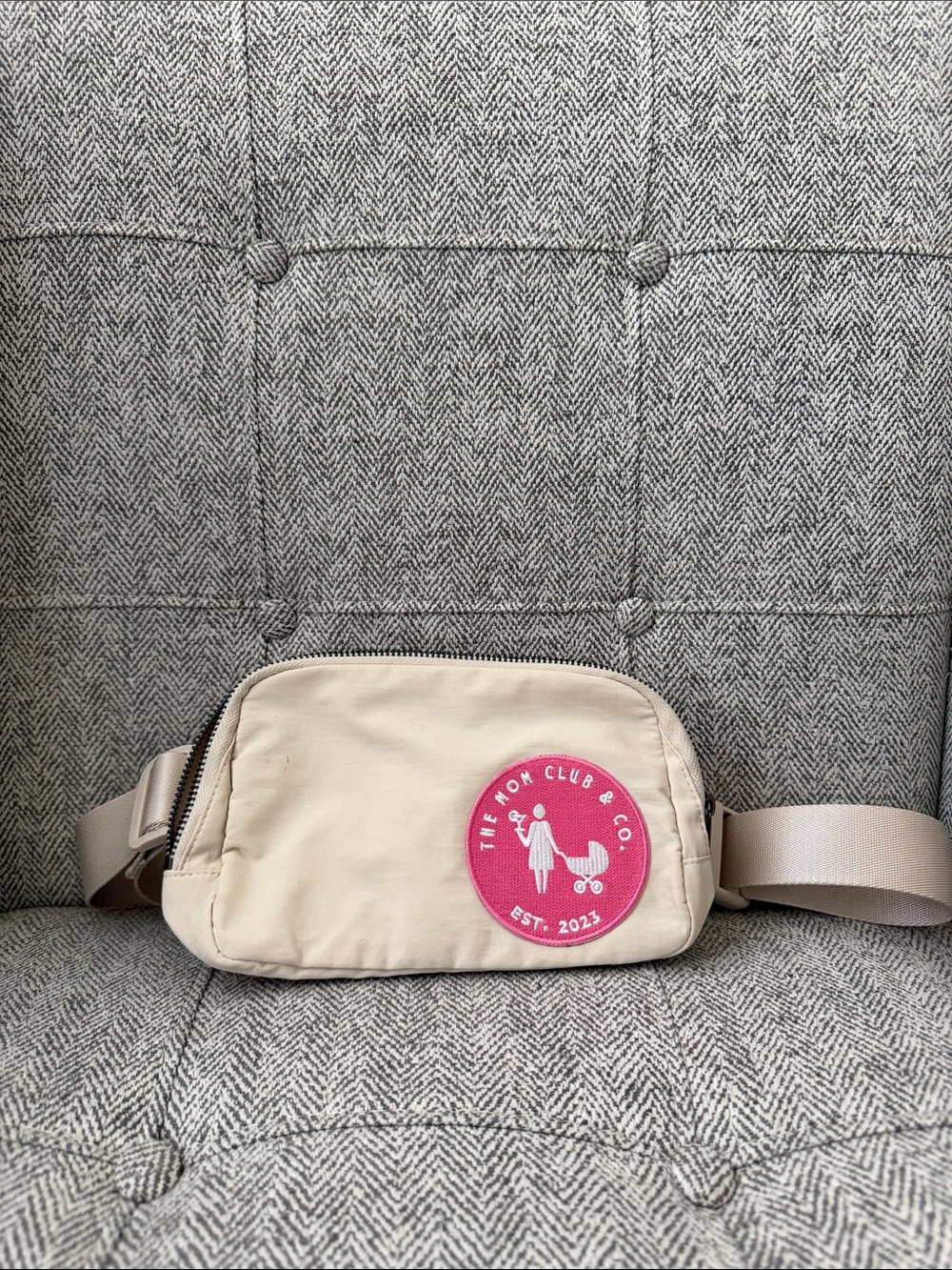 The Mom Club & Co. Cream Waist Bag with Pink Patch